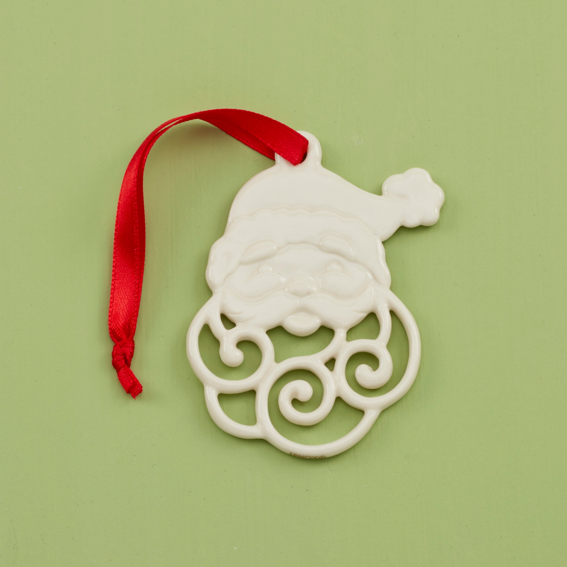Handcrafted Porcelain Santa Charm Ornament with Pierced Detailing
